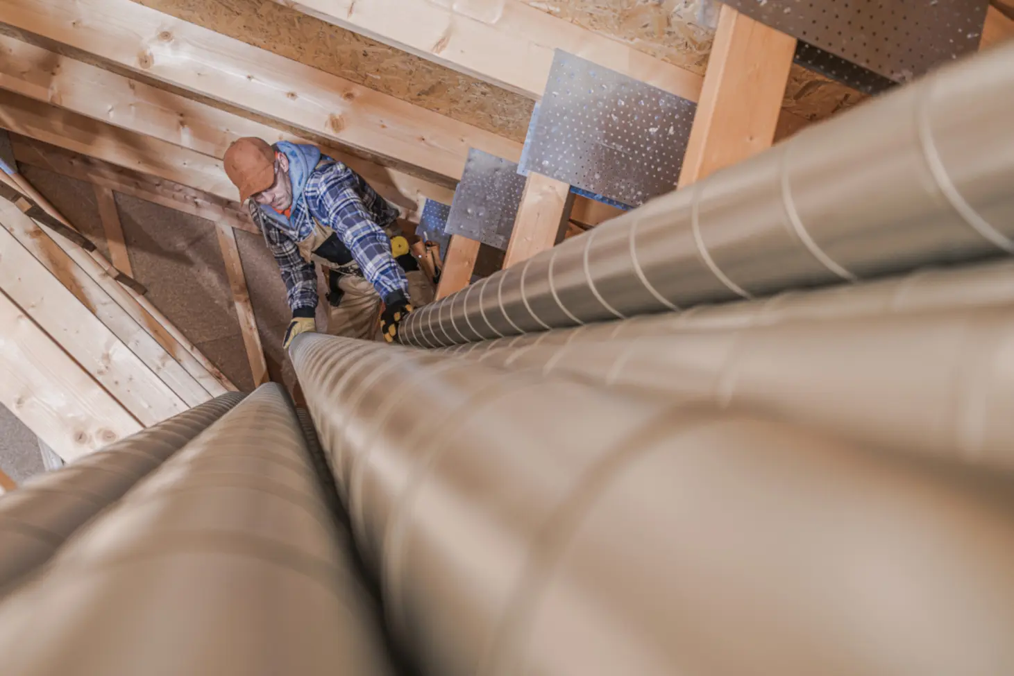 Worker inspecting air ducts